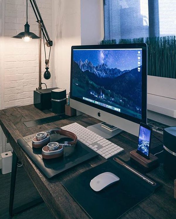 A desk with a computer and phone on it